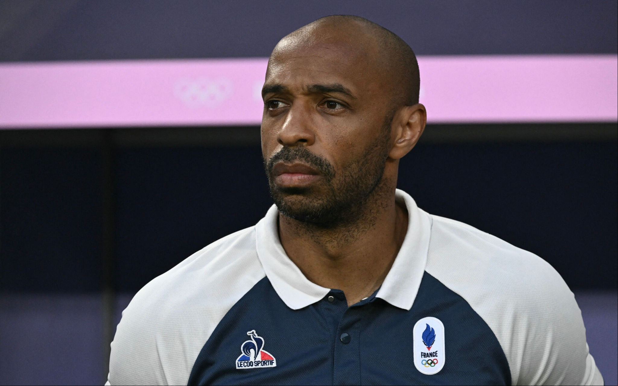 (FILES) 's coach Thierry Henry is seen before the men's quarter-final football match between  and Argentina during the Paris 2024 Olympic Games at the Bordeaux Stadium in Bordeaux on August 2, 2024. Thierry Henry has decided to step down as coach of the French U-21 team after reaching the final of the Paris-2024 Olympic Games, the French Football Federation announced on August 19, 2024. (Photo by Philippe LOPEZ / AFP)